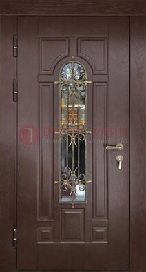 Темная железная дверь со стеклом и ковкой для частного дома ДСК-156 в Рязани